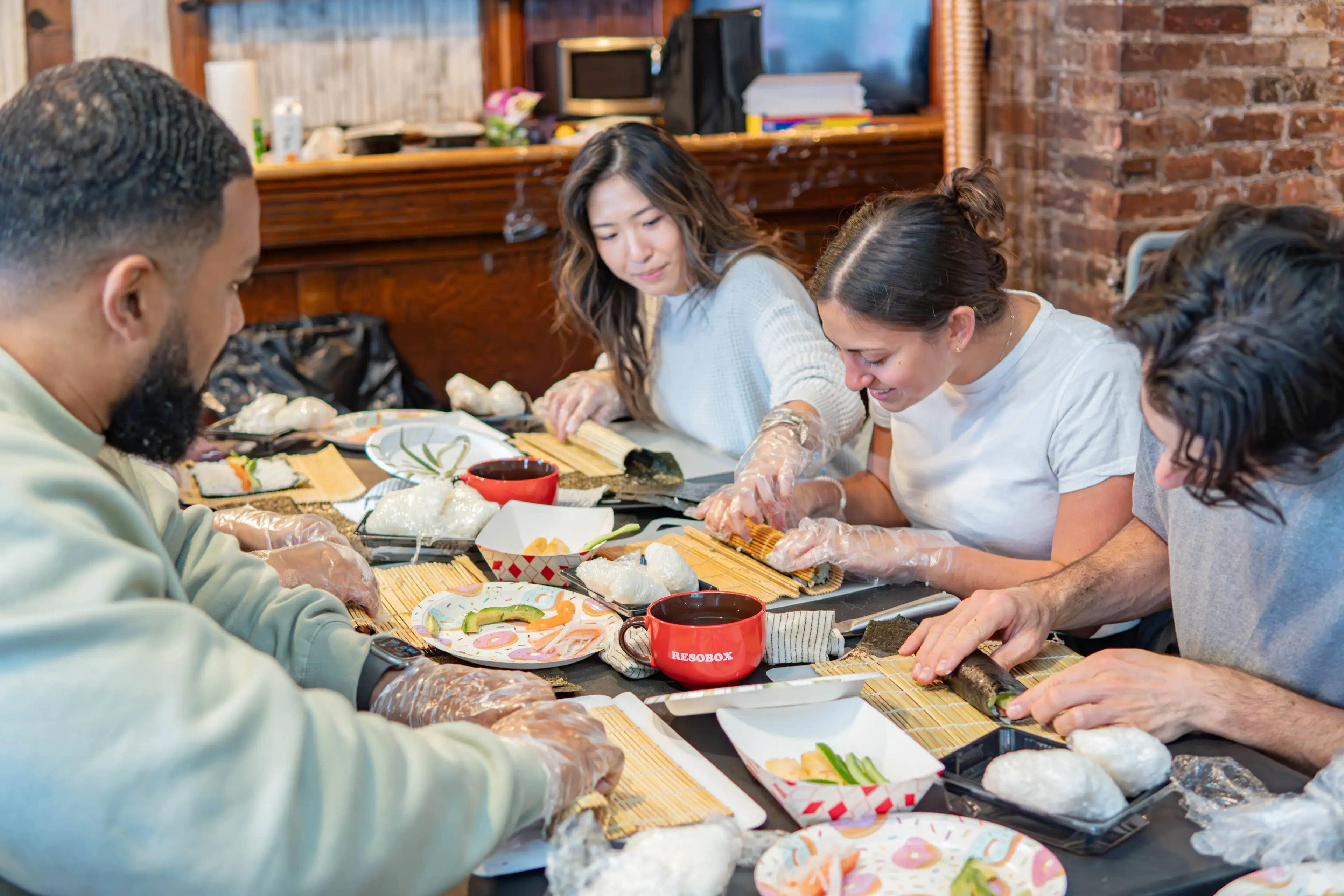 Coworkers making sushi together