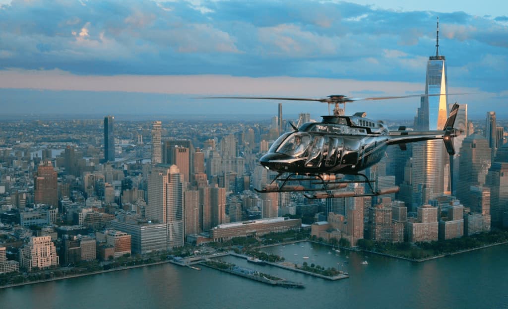 a helicopter flying over a city