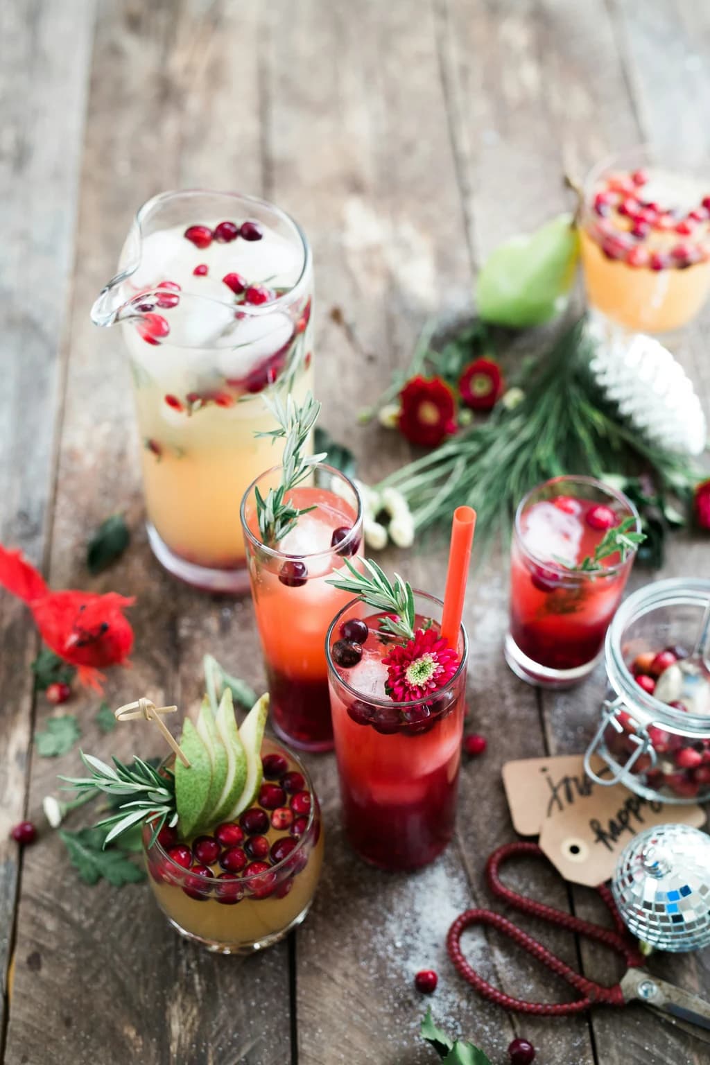 a tabel with holiday drinks on it and ingrediants around it