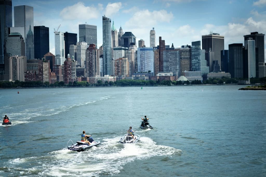 Jetskis on the Hudson River with NYC skyline in the background.