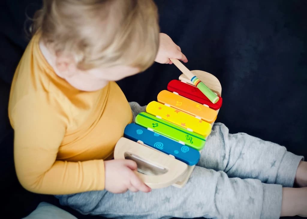 a child playing with an instrument