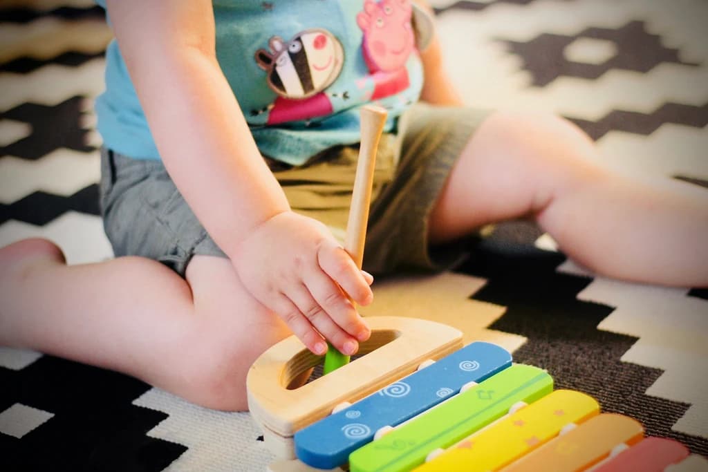 a child playing with an instrument