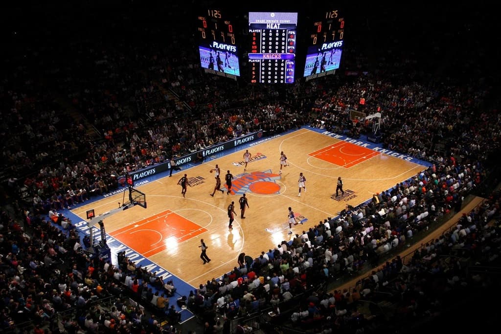 Spacious suite at Madison Square Garden with premium seating and catering service during a Knicks game.