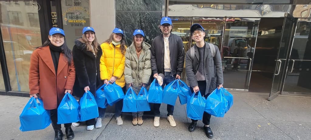 a man putting meal kits into a van