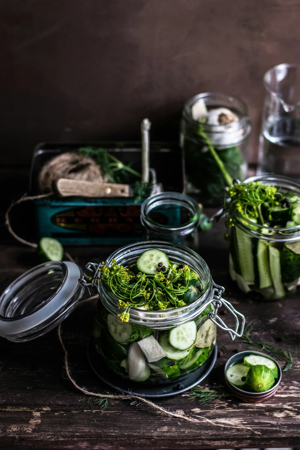 a jar of pickles with spices on them