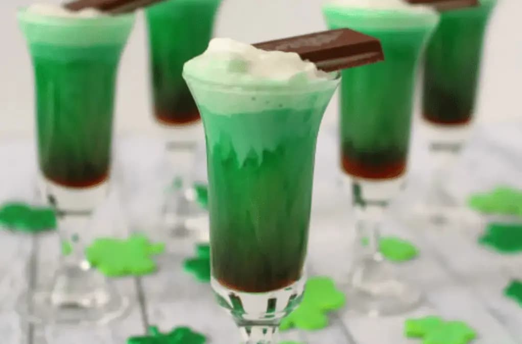 green drinks with whipe cream and a chocolate on top