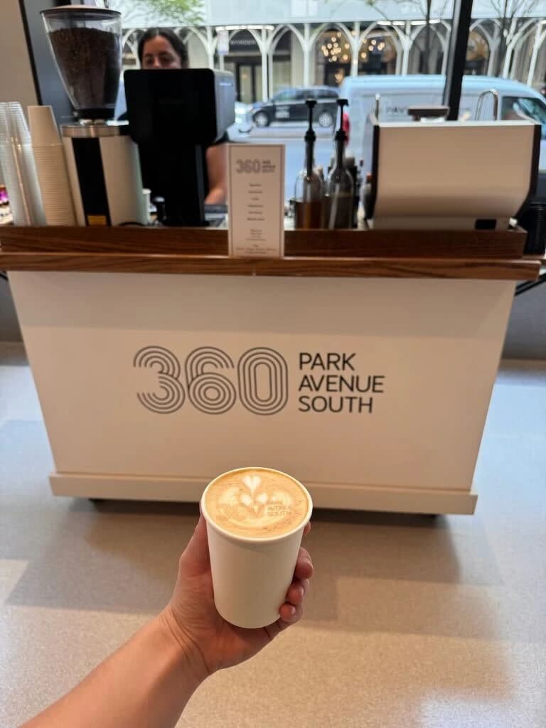 360 Park Avenue South branded coffee cart with custom logo latte art