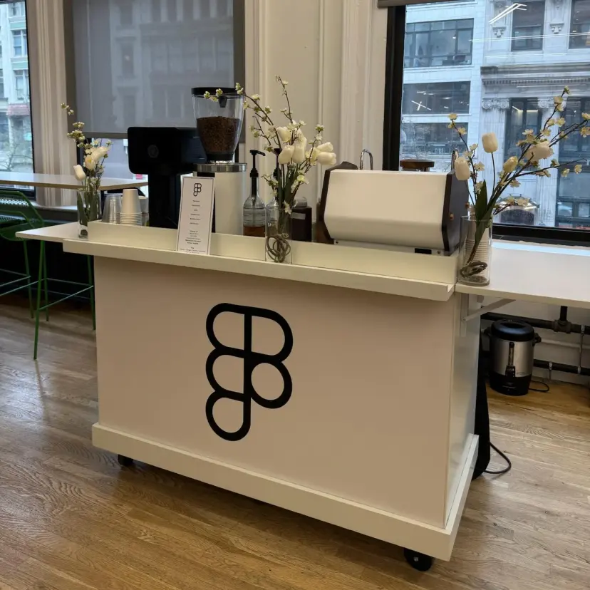 Custom branded Figma coffee cart with espresso machine in modern office
