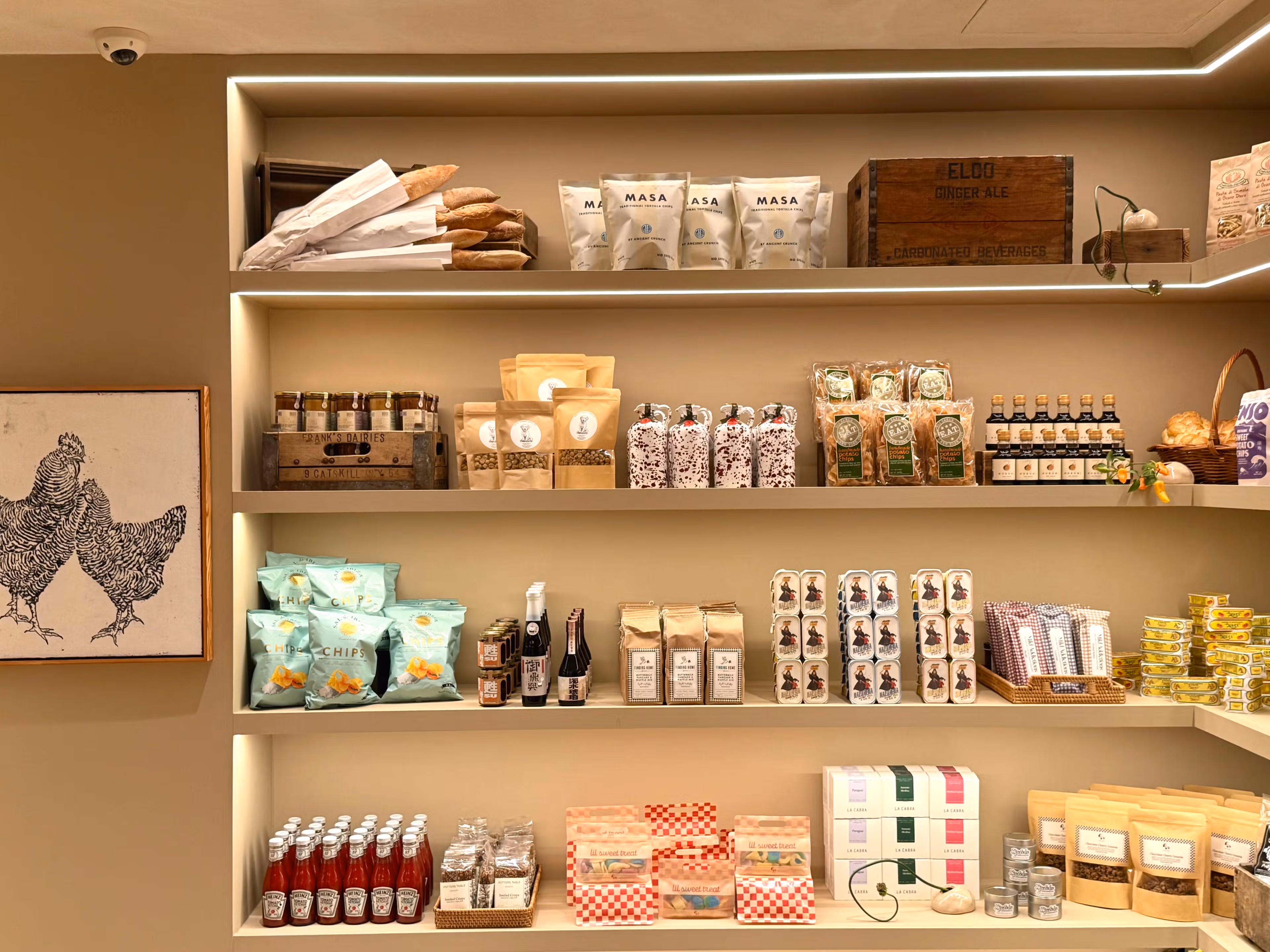 Shelves of specialty foods, pantry goods, and fresh bread at Meadow Lane