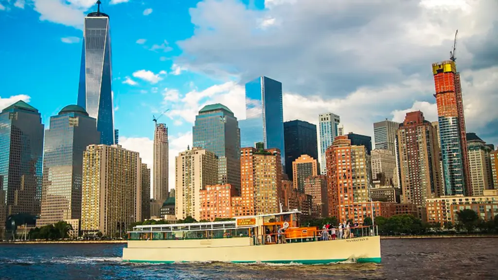 a boat on the water in front of the new york city skyline