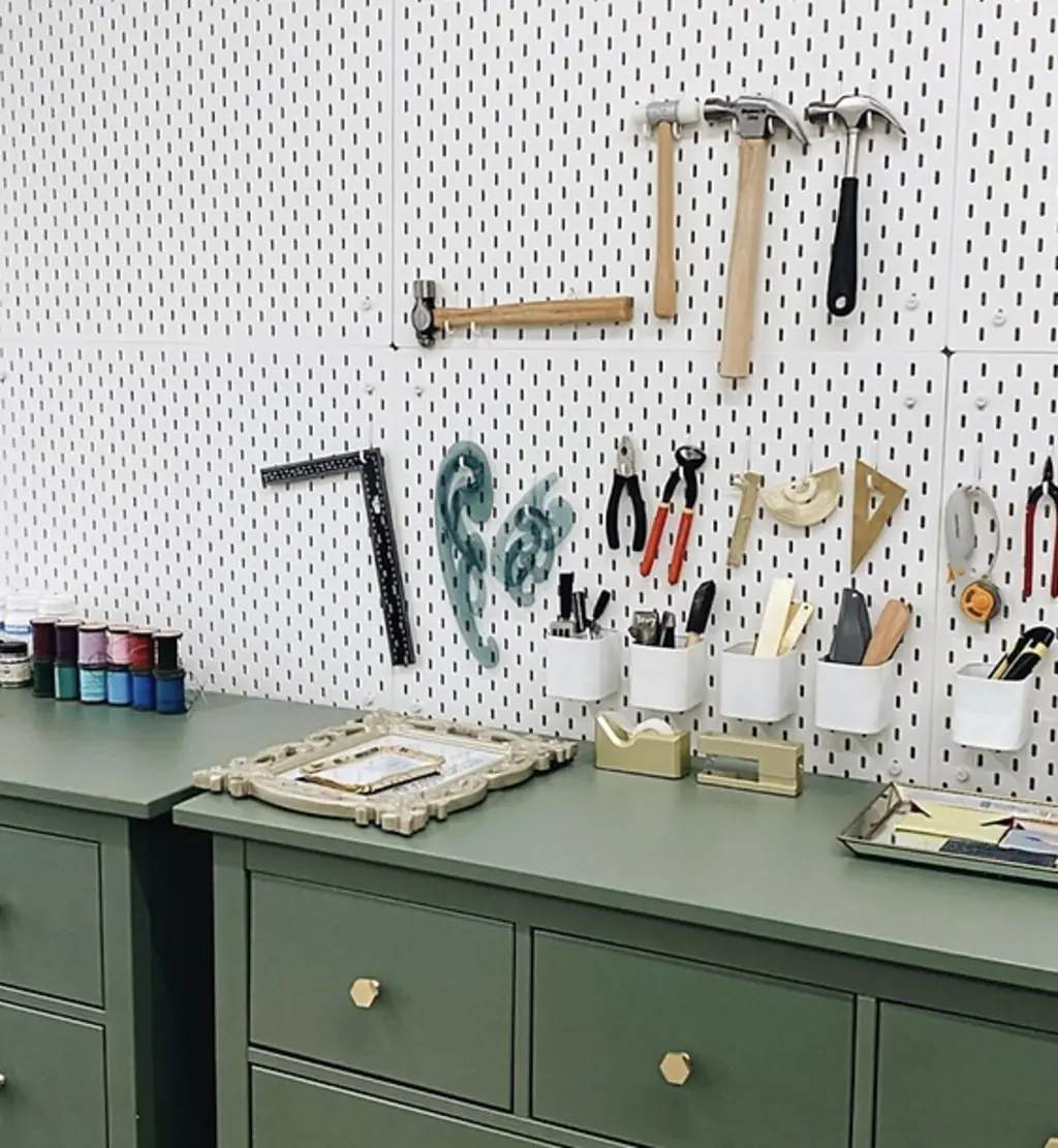 a work bench with tools for crafting leather on it